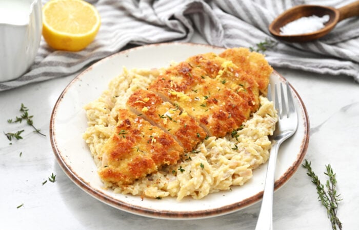 a serving Crispy Parmesan Chicken with Creamy Lemon Orzo