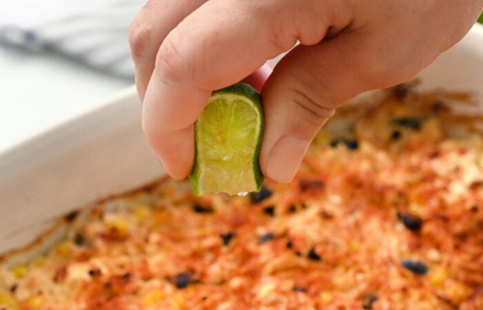 squeezing lime on chicken