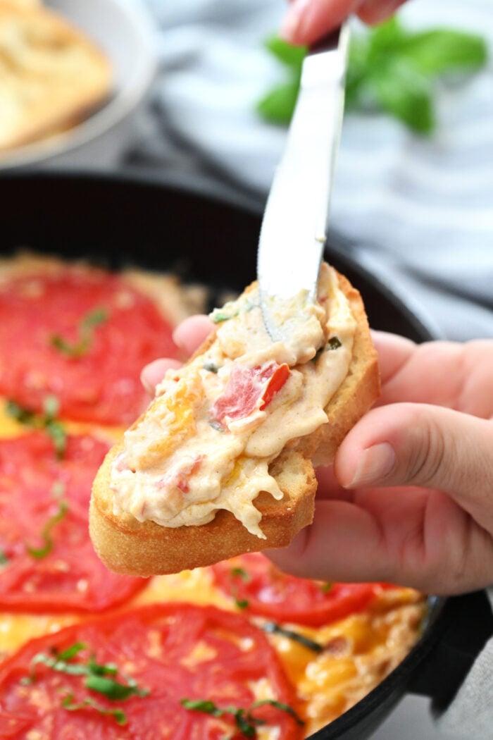 spreading dip crostini