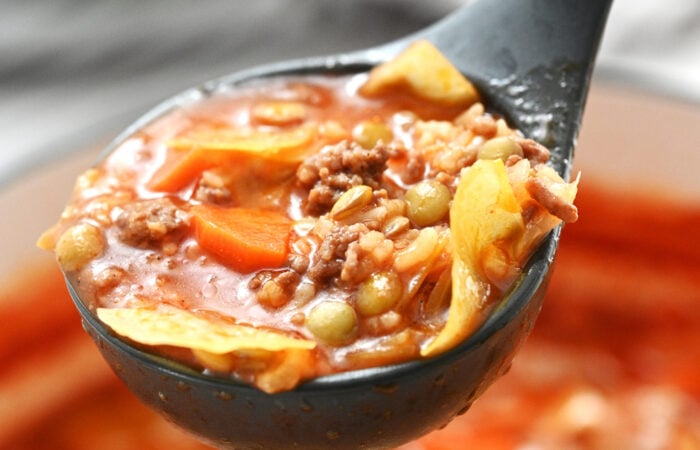 a ladle cabbage soup