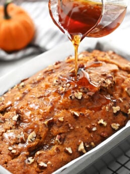adding drizzle syrup to pumpkin bread