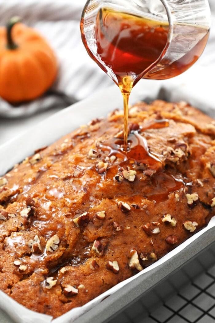 adding drizzle syrup to pumpkin bread